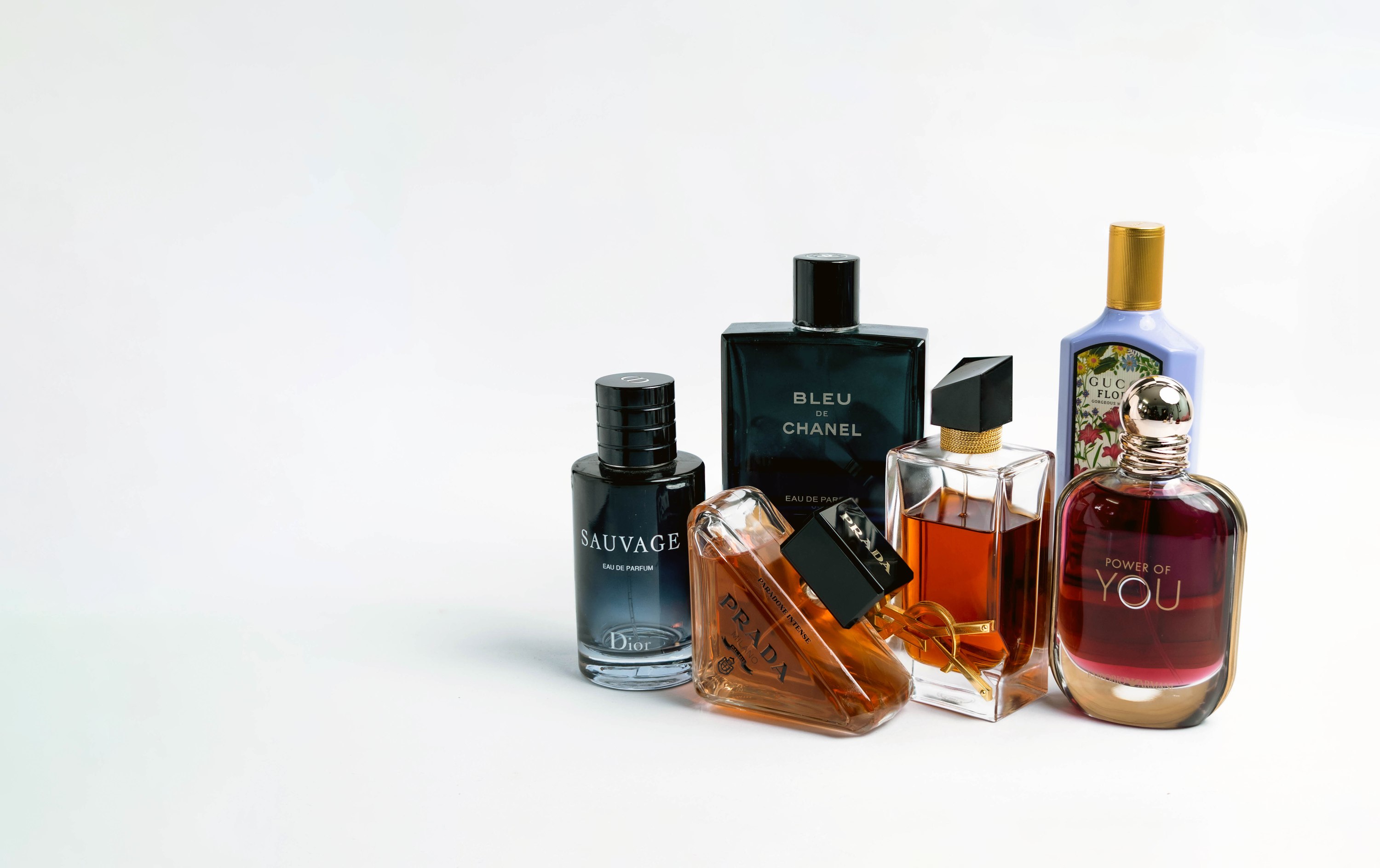 Sauvage, Bleu de Chanel, Prada, YSL, and Gucci Flora decants, grouped together